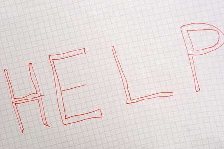 Paper notebook with handwriting help messageの写真素材