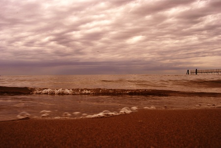 Soft wave of the sea on the sandy beach 
