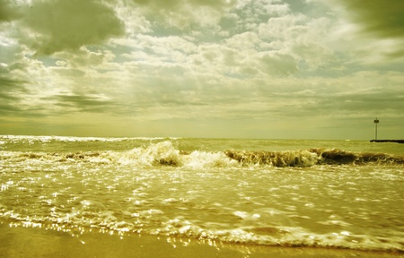 detail of beach, water and small stones in summer の写真素材