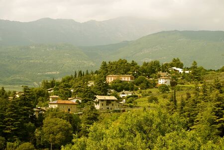Beautiful small green town in the alps from above, City Rovereto in Italyの写真素材