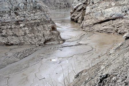 Exposed lake bed in the high country of Italy after a dry summer periodの写真素材