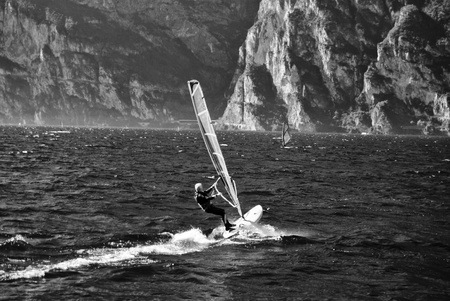 windsurfer panorama silhouette against a sparking  lake of Garda, in Trentino. Italyの写真素材
