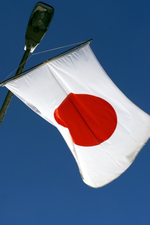 Japanese flag with blue sky background