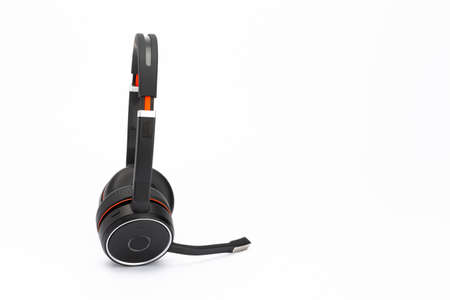 Black headphones / head-set with microphone with a white background