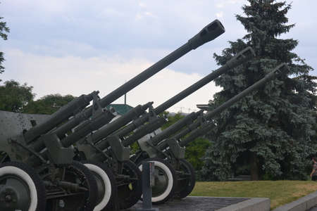 The Ukrainian cannons in a row in the cannon field are aimed towards the skyの写真素材