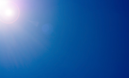 A Clear blue sky with lens flare の写真素材