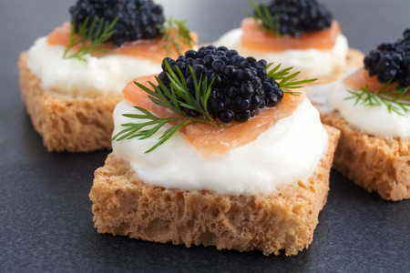 Canape of Caviar on top of salmon with cream cheese, room for textの写真素材