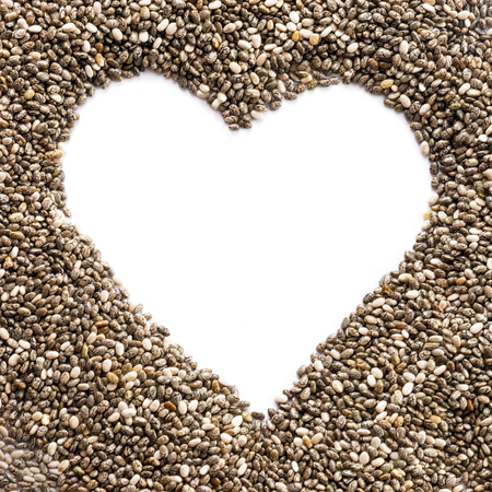 Healthy chia seeds with blank heart shaped copy space to place texts on white in a square formatの写真素材