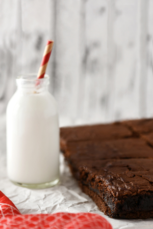 chocolate brownies with a bottle of milk , shot for text overlay  minimum focus,  plan background to ad copy spaceの写真素材