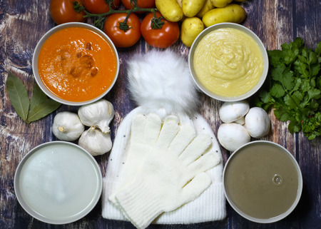 selection of home made winter soups showing fresh ingredients, tomato potato, mushroom and garlic, over head shot with copy spaceの写真素材
