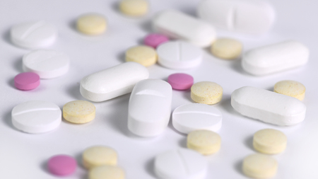 an amount of prescription medication ,  selective focus and copy space to the sides