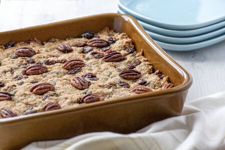 Delicious Plant based  vegan cake ,recipe filled with nuts fruit and oats  copy space in background