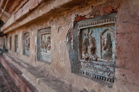 Buddhas Life told in reliefs at a temple complex at Bagan Myanmar.の写真素材