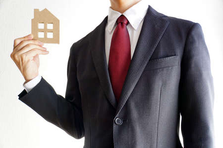 Businessman thinking about the house.の写真素材