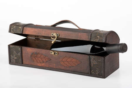Wood box with one red wine bottleの写真素材