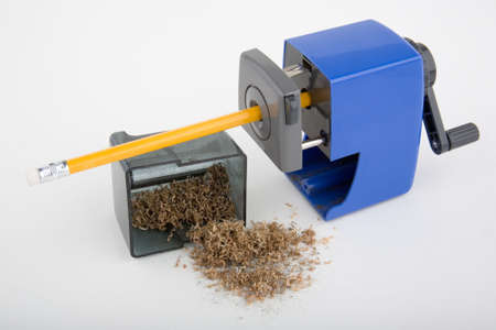 New pencil being sharpened in hand-crank sharpenerの写真素材