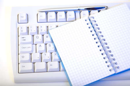 keyboard, notepad and penの写真素材