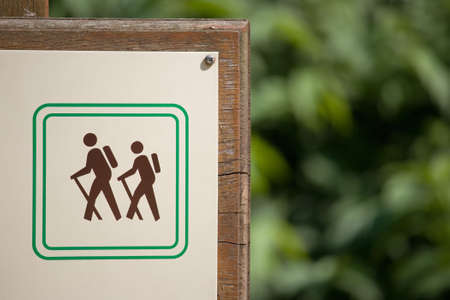 touring sign with blurred forest backgroundの写真素材