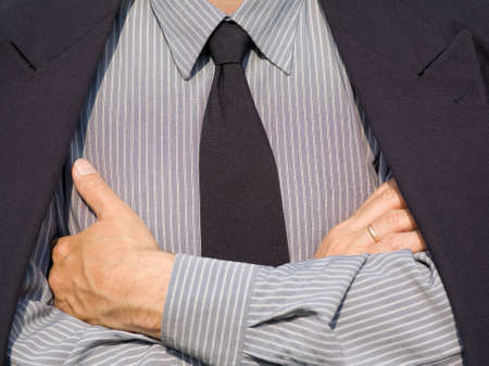 businessman in suit with crossing his handsの写真素材