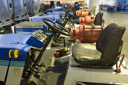 parking gas powered cargo cars in the airportの写真素材