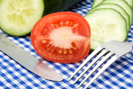 tomato and cucumber on checked backgroundの写真素材