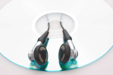 earphones and cd isolated on white backgroundの写真素材