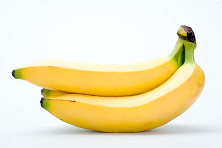banana bundle isolated on white backgroundの写真素材