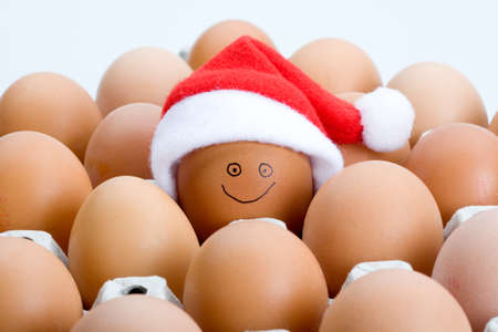 Smiling egg in a santa hat, isolatedの写真素材