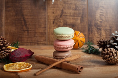 Christmas background with macaroons on wood backgroundの写真素材