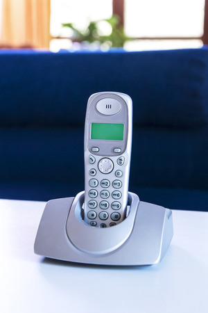 cordless phone on a tableの写真素材