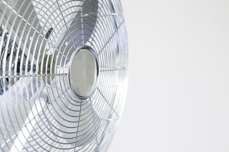 air cooler chrome Metal fan on a white background with spinning blades during summer period.の写真素材