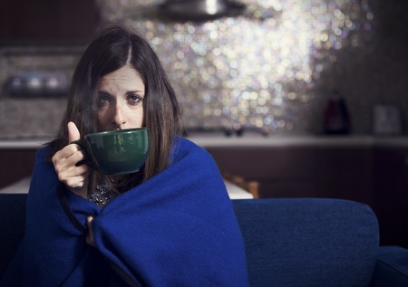 young sick girl drinking herbal tea young sick girl drinking herbal tea
