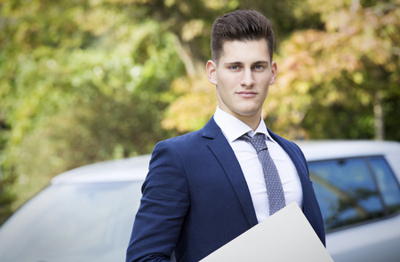 beautiful young insurance agent watching straight in camera.の写真素材