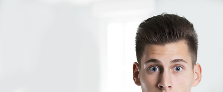 Thoughtful businessman watching curious  to camera on white background .の写真素材