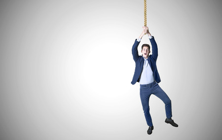 business man hanged. ona  rope