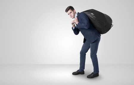 business man pulling garbage..の写真素材