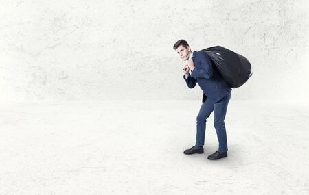 business man pulling garbage..の写真素材