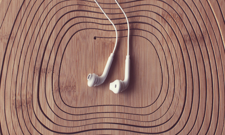 beautiful earplugs on wood surface with color filters.の写真素材