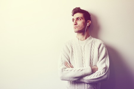 younf man addicted to music lintening from earphonesの写真素材