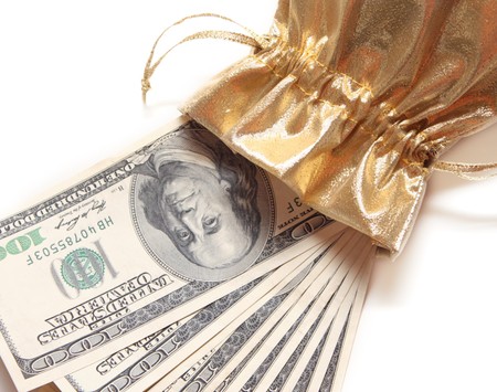 Dollar banknotes in a gold purse. Object over whiteの写真素材