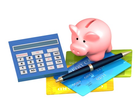 Piggy bank, credit card and calculator. Isolated over whiteの写真素材