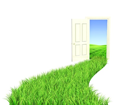 Conceptual image - road with bright green grassの写真素材