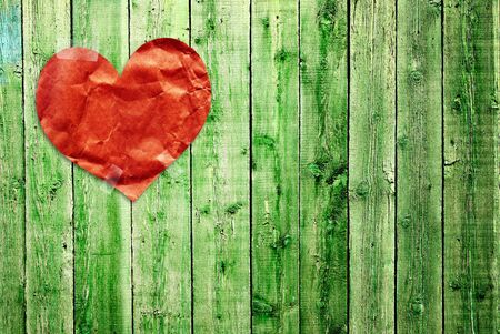 Grunge valentine background with paper heartの写真素材