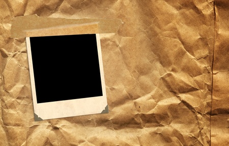 Single old photo over paperの写真素材