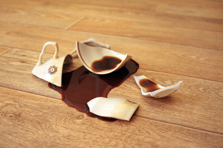 Coffee, flowed out from the broken cup