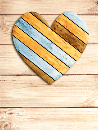 Wooden heart on old wood boardsの写真素材