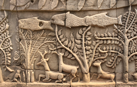 Wall carving of Prasat Bayon Temple, in famous landmark Angkor Wat complex, khmer culture, Siem Reap, Cambodiaの写真素材