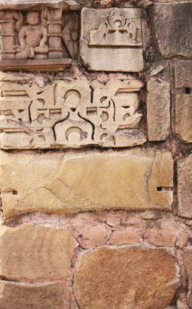 Stone wall and human sculpture at temple in Khajuraho, Indiaの写真素材