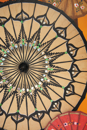 Myanmar traditional paper umbrella of beige color の写真素材