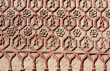 Bas-relief carving with floral ornament on old stucco wall, Taxco de alarcon, Mexico